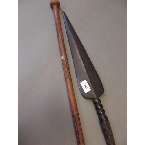 An antique hardwood ceremonial tribal short spear with carved ...