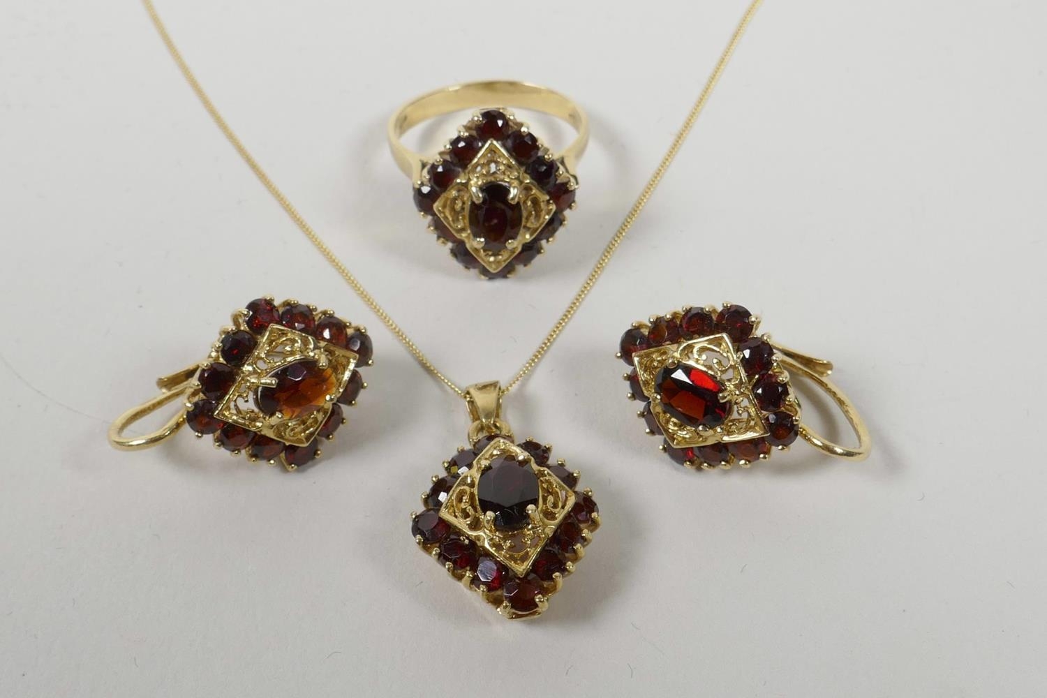 A Suite Of 14ct Yellow Gold And Garnet Set Jewellery Including A Ring Pendant Necklace And Pair Of