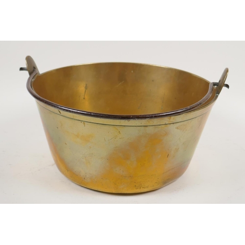 1 - A C19th brass jam pan with iron swing handle, 10