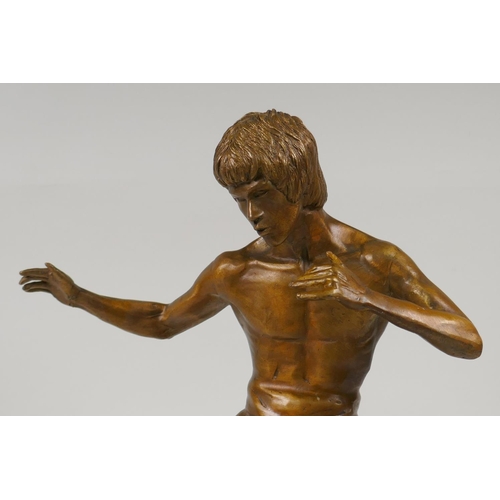 13 - A bronze figure of Bruce Lee, 13½