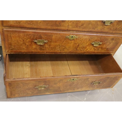 443 - An early 19th Century walnut chest on chest fitted with nine drawers and slide, raised on bracket su... 