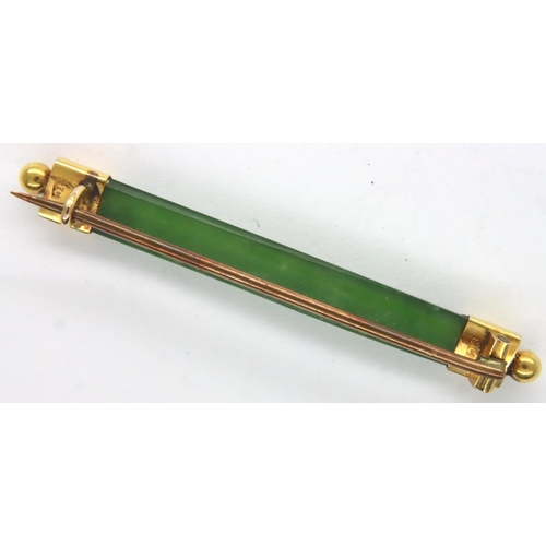 10 - 9ct gold mounted jade brooch, L: 54 mm, 2.9g. P&P Group 1 (£14+VAT for the first lot and £1+VAT for ... 