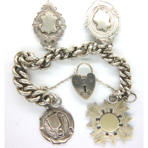 14 - Hallmarked silver bracelet with four fobs and padlock clasp, L: 16 cm, combined 62g. P&P Group 1 (£1... 