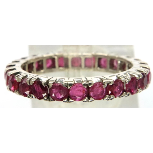 17 - White metal and ruby full eternity ring, size O/P, 3g. P&P Group 1 (£14+VAT for the first lot and £1... 