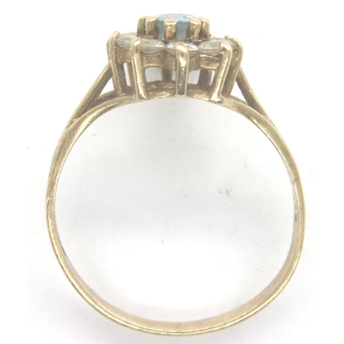 29 - 9ct gold topaz daisy ring, size N/O, 1.8g. P&P Group 1 (£14+VAT for the first lot and £1+VAT for sub... 
