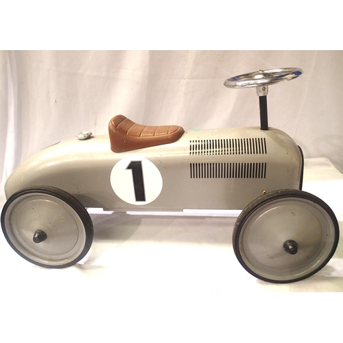 2027 - Childs push along, sit on silver racing car with steaming wheels. Approximately 75 cm and long seat ... 
