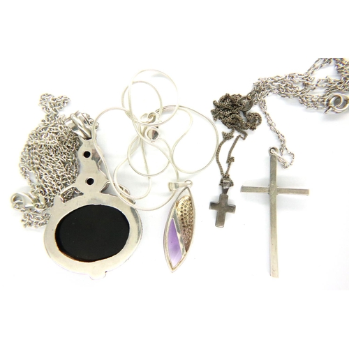 41 - Four 925 silver pendant necklaces to include cross examples. P&P Group 1 (£14+VAT for the first lot ... 