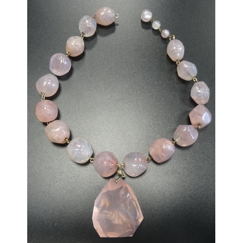 35 - ROSE QUARTZ BEAD NECKLACE
the beads of irregular form, 43cm long, together with a large rose quartz ... 