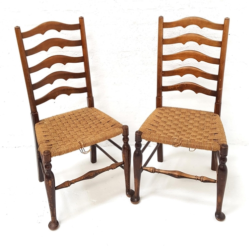 443 - PAIR OF ELM LANCASHIRE LADDER BACK CHAIRS
with woven rush seats, standing on tapering front supports... 