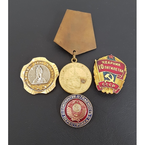 342 - SOVIET RUSSIAN THE MEDAL FOR THE DEFENSE OF LENINGRAD
together with three gilt metal and enamel Sovi... 