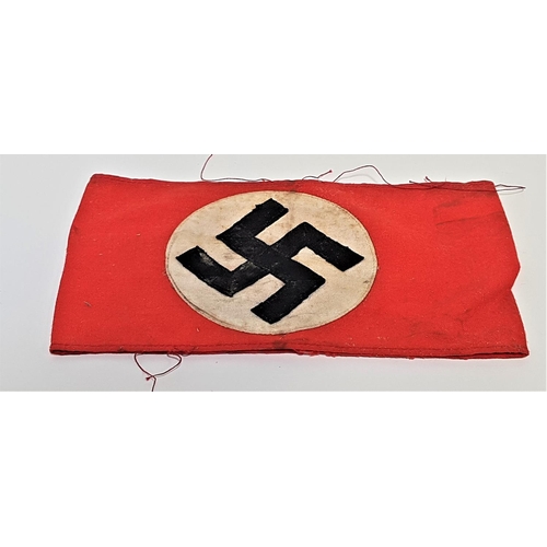321 - GERMAN THIRD REICH NSDAP PARTY ARMBAND
the red cotton armband with a multi piece black swastika to t... 