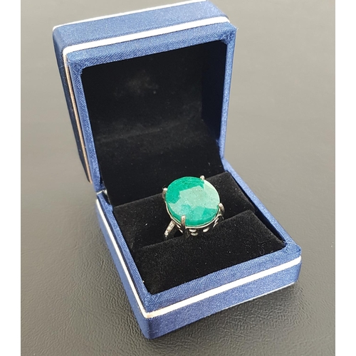 109 - LARGE EMERALD SET RING
the oval cut emerald measuring approximately 18.7mm x 16.1mm x 9.45mm, flanke... 