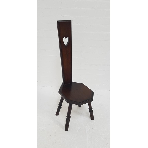 420 - MAHOGANY SPINNING CHAIR
with a tapering back and heart shaped cut out handle above a shaped seat, st... 
