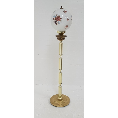 421 - BRASS STANDARD LAMP
in the form of an Edwardian oil lamp, raised on a circular base with a four sect... 