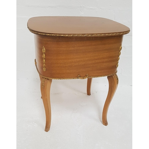 438 - AMORCO MAHOGANY AND GILTWOOD SEWING TABLE
with a lift up lid revealing a fitted interior and cotton ... 