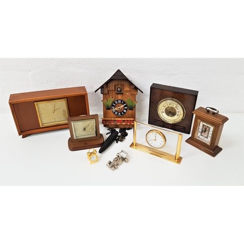 243 - SELECTION OF TIMEPIECES
including a German cuckoo clock, racing car desk clock, traditional style mi... 