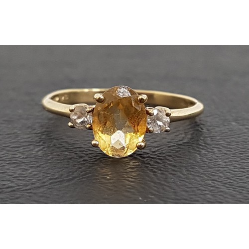 50 - CITRINE AND WHITE SAPPHIRE THREE STONE RING
the central oval cut citrine approximately 1.1cts flanke... 