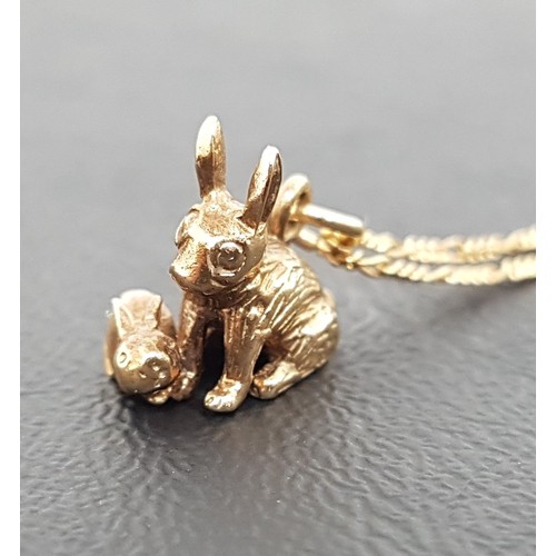 97 - NINE CARAT GOLD RABBIT PENDANT
formed as adult and kitten, on nine carat gold chain of approximately... 