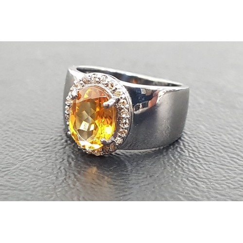 105 - CITRINE AND DIAMOND CLUSTER RING
the central oval cut citrine in rose cut diamond surround, on oxidi... 