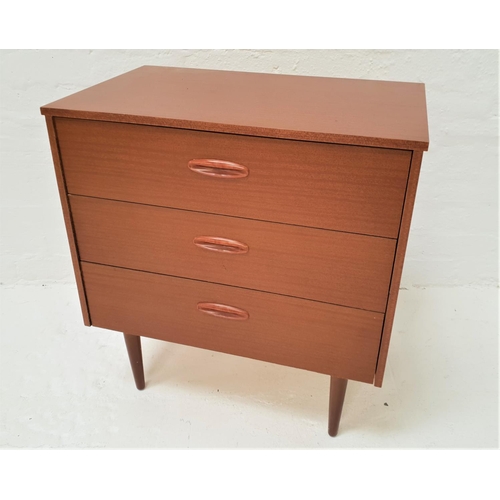 412 - TEAK EFFECT CHEST
with three drawers with part inset handles, standing on turned tapering supports, ... 