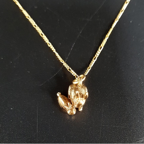 97 - NINE CARAT GOLD RABBIT PENDANT
formed as adult and kitten, on nine carat gold chain of approximately... 