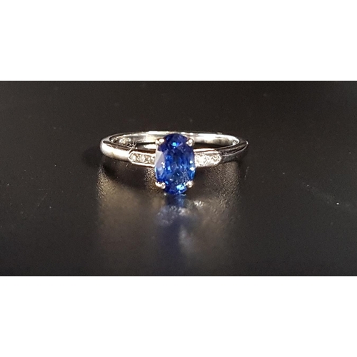 124 - SAPPHIRE AND DIAMOND RING
the central oval cut sapphire weighing approximately 0.95cts flanked by th... 