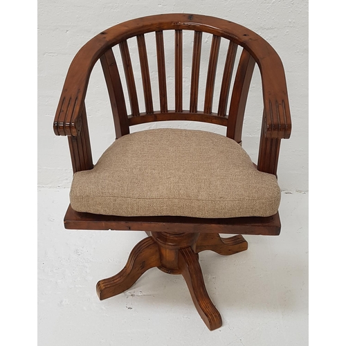 431 - TEAK CAPTAIN'S STYLE SWIVEL CHAIR
with a hoop back above a solid seat with a shaped cushion, raised ... 