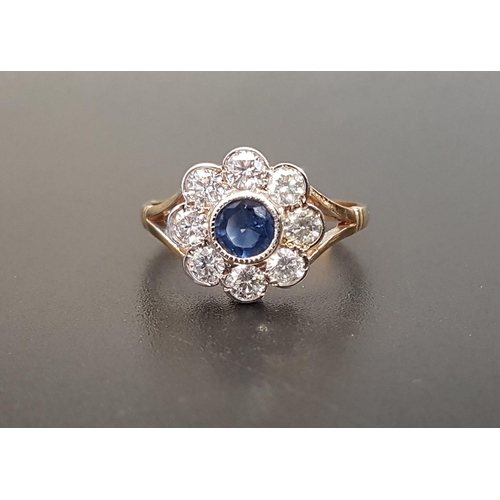 137 - SAPPHIRE AND DIAMOND CLUSTER RING 
the central bezel set sapphire approximately 0.35cts in eight dia... 