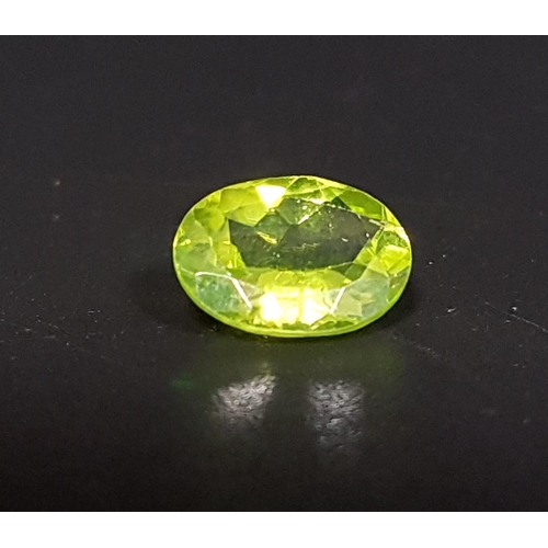 46 - CERTIFIED LOOSE NATURAL PERIDOT
the oval cut gemstone weighing 1.87cts, with ITLGR Gemstone Report