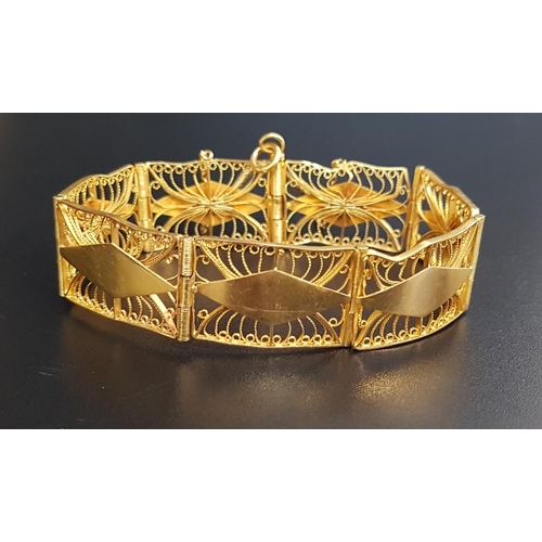 82 - ATTRACTIVE UNMARKED HIGH CARAT GOLD BRACELET
the rectangular links with pierced filigree decoration,... 