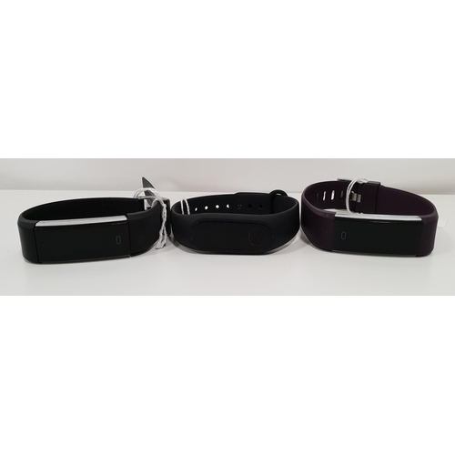 181 - MI FITNESS TRACKER
together with two Generic Fitness Trackers (3)