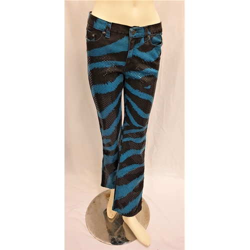 36 - CARMEN ELECTRA - 'ROBERTO CAVALLI' BLUE TIGER PRINT TROUSERS
with sequined detail, size XS. Accompan... 