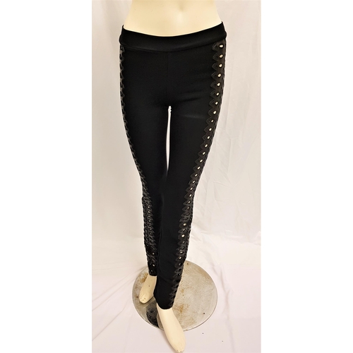 38 - CARMEN ELECTRA - BLACK STRETCH TROUSERS WITH FAUX LEATHER CUT OUT SIDES
by Cesar. Accompanied by Sta... 