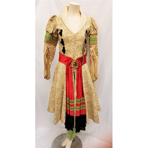 96 - SCOTTISH BALLET - ALLADIN
Gold and cream frock coat with gold and green embellishment to sleeve and ... 