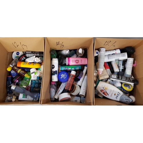 12 - THREE BOXES OF NEW AND USED TOILETRY ITEMS
including Versace, Ghost, Joop, Garnier, Dove, Bondi Sand... 