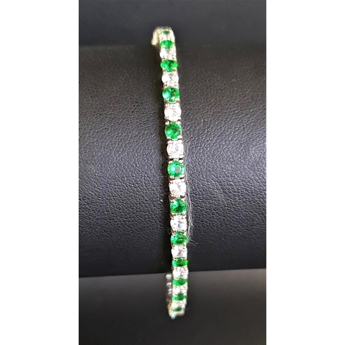 74 - GREEN AND WHITE CZ SET LINE BRACELET
in silver, approximately 18cm long