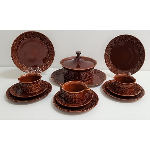 142 - PORTMEIRION DINNER SERVICE
with a treacle brown glaze and roundel decoration, comprising six entrée ... 