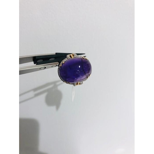 20 - 18k yellow gold ring with diamonds around 0.60cts withcabochon amethyst around 5ct; N1/2; 9.4g