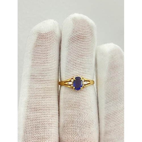 21 - 18k Yellow Gold Light Blue Sapphire Set Ring With Shoulder Diamonds 0.91ct total weight.