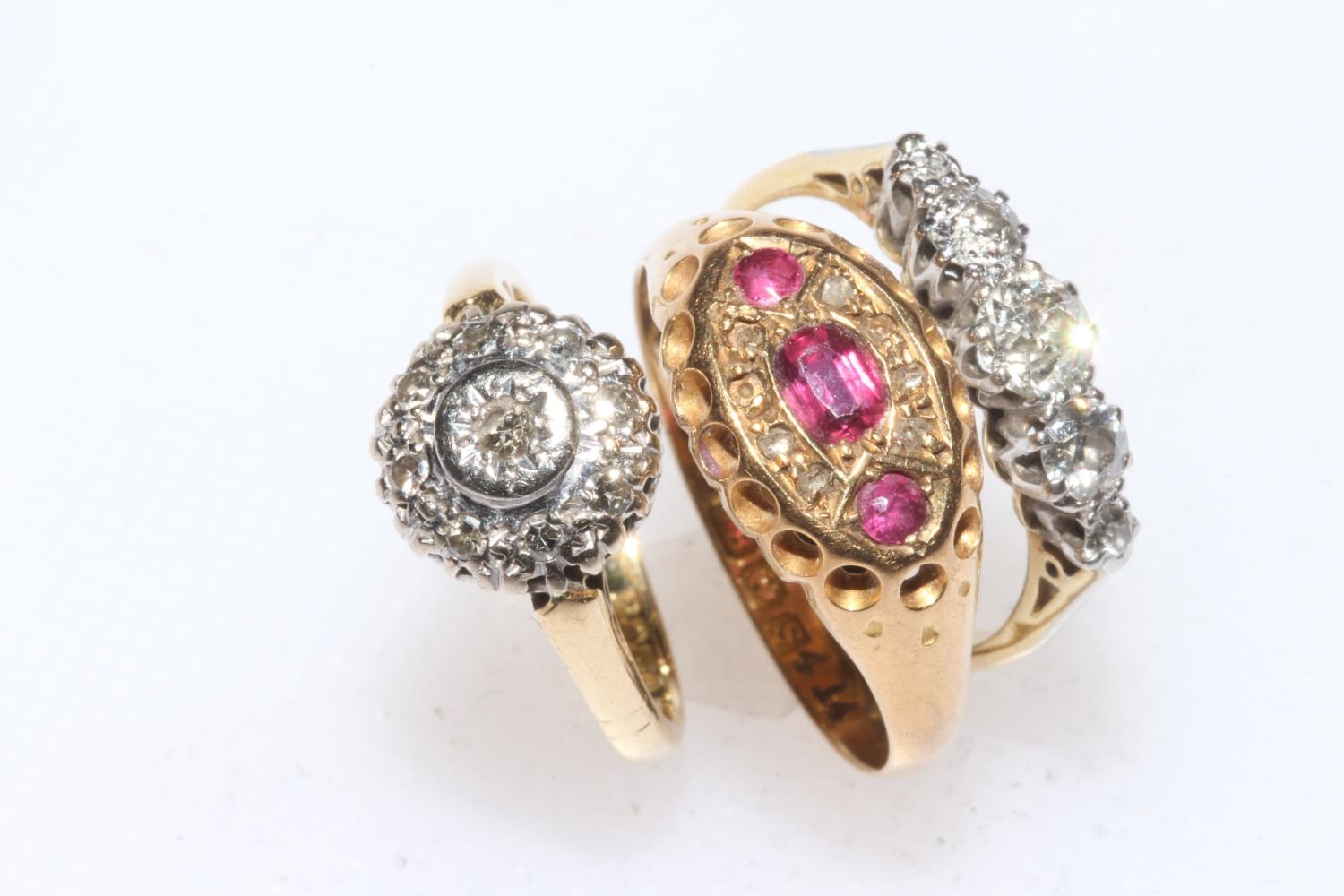 Three 18 carat gold rings including ruby, Birmingham 1917, and five ...