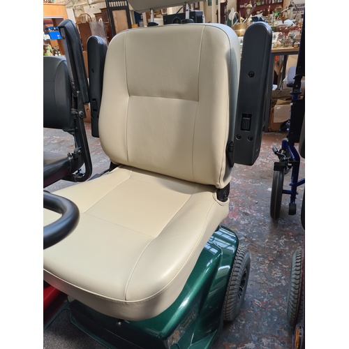 A CRAFTMATIC COMFORT COACH IV GREEN MOBILITY SCOOTER WITH KEY AND