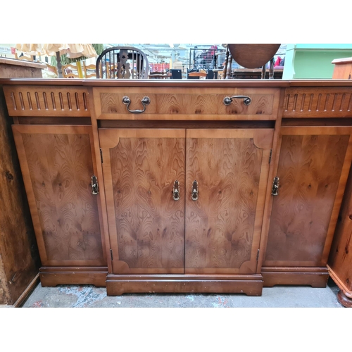 A LATE 20TH CENTURY STRONGBOW FURNITURE YEW WOOD SIDEBOARD WITH FOUR