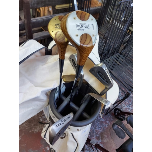 A white Slazenger golf bag containing Penfold golf clubs