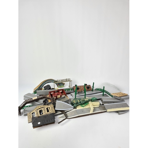 A box containing OO gauge model railway accessories to include station