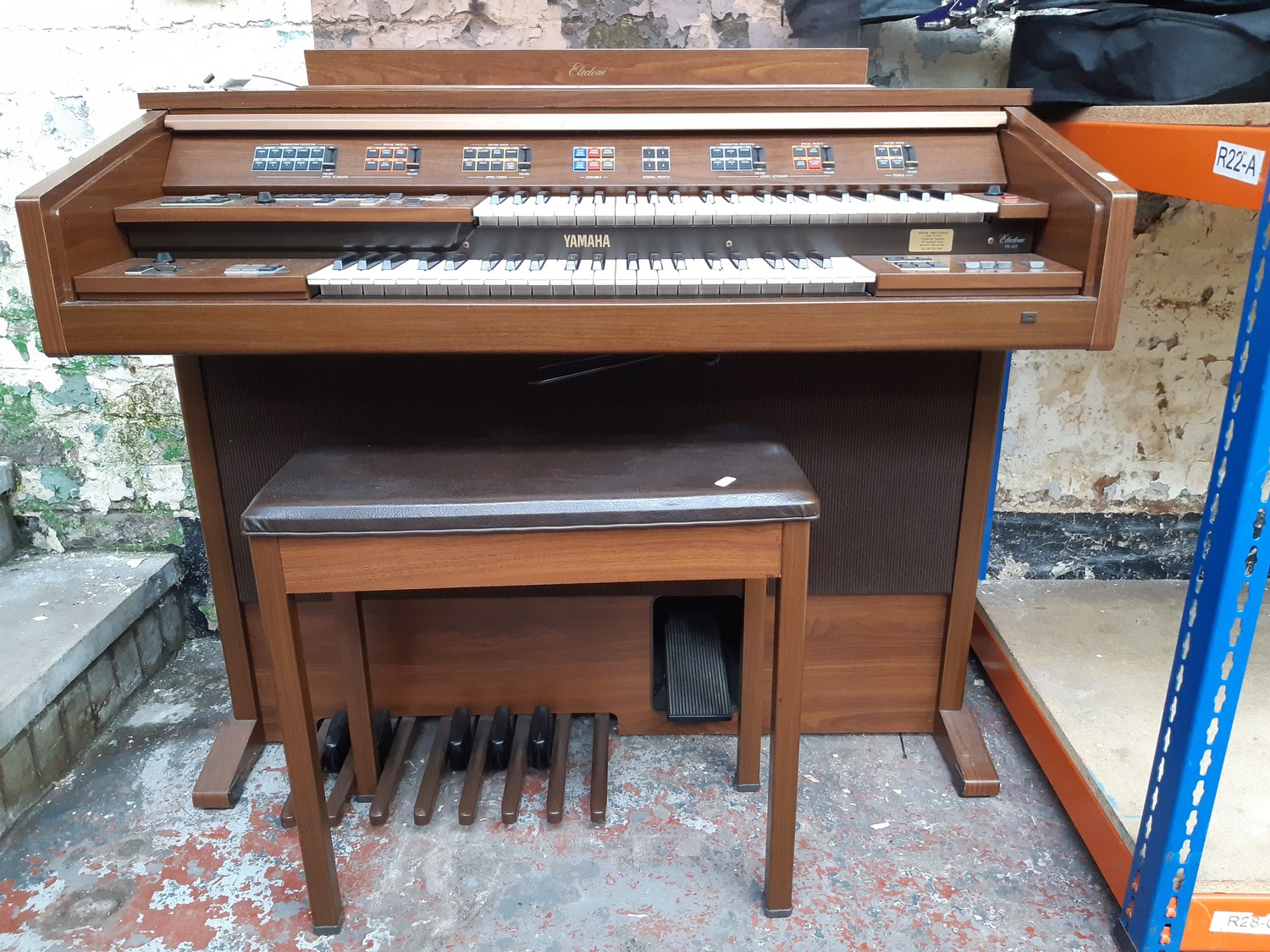 A Yamaha Electone FE-40 electric organ with stool