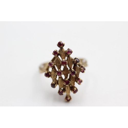 17 - A 9ct gold ruby cluster ornate textured navette setting statement ring, size Q½ - approx. gross weig... 