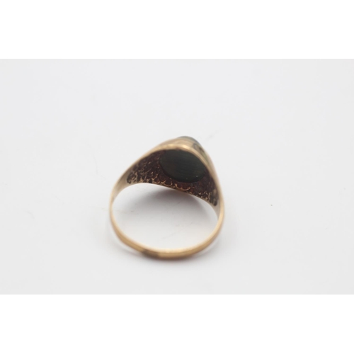 18 - A 9ct gold tiger's eye solitaire statement ring, size L½ - approx. gross weight 2.6 grams