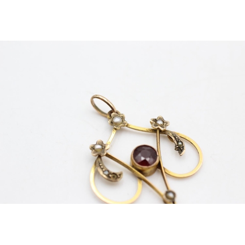 26 - An Art Nouveau 9ct gold garnet and seed pearl lavalier pendant - approx. gross weight 2.3 grams