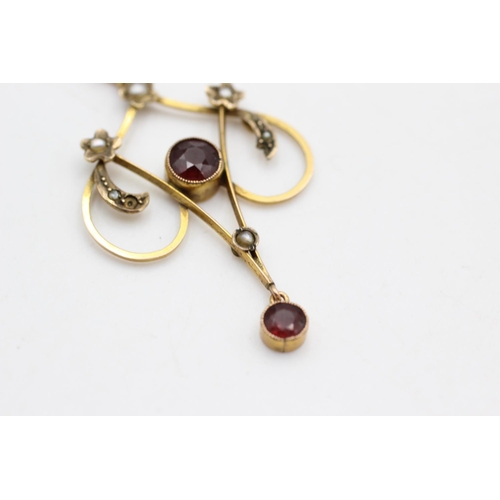 26 - An Art Nouveau 9ct gold garnet and seed pearl lavalier pendant - approx. gross weight 2.3 grams
