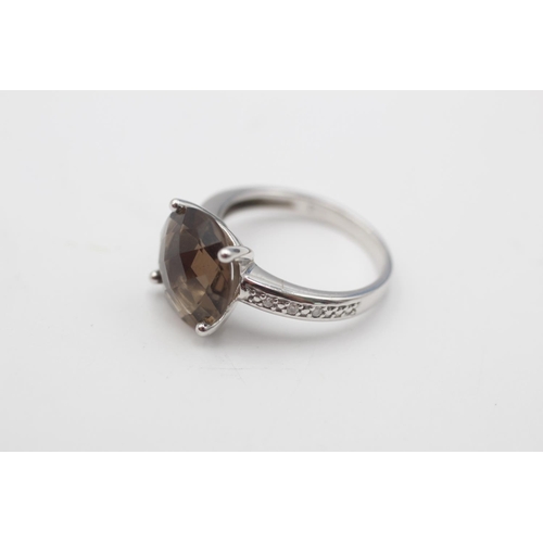 27 - A 9ct white gold smoky quartz and diamond dress ring, size K½ - approx. gross weight 3.1 grams
